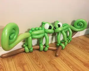 Handmade green balloon chameleons with curled tails